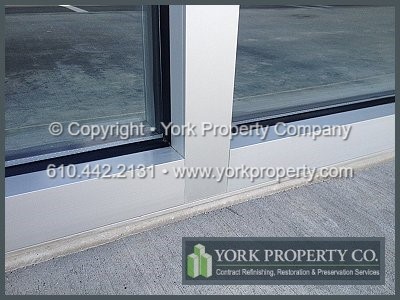 Wash acidic concrete from anodized aluminum, clean corrosive stucco off of anodized aluminum and remove caustic mortar from anodized aluminum. Clean stained, pitted, acid etched and damaged exterior anodized aluminum storefront window frames.