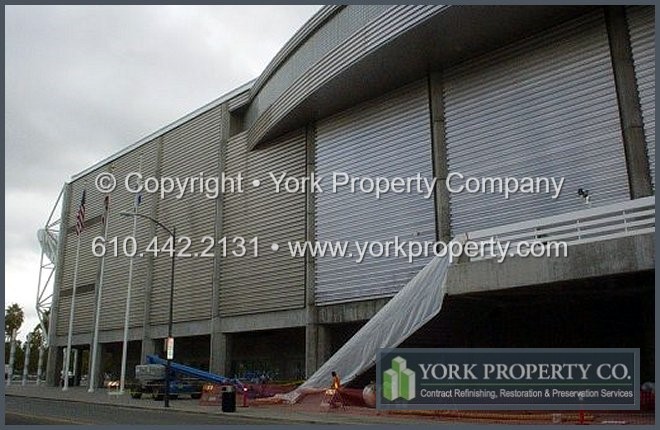 Protecting, preserving, refurbishing, maintaining, repairing and refinishing metal cladding, metal siding, metal panels and metal ground floor storefront window frames.