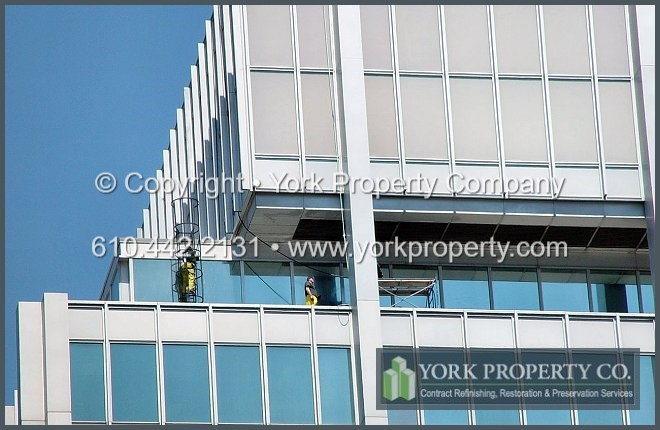 Cleaning, repairing and restoring damaged, dirty, faded and oxidized metal curtain wall panels, metal window mullions, metal column covers and metal ground floor storefront window frames and doors.