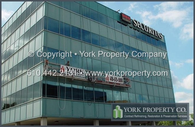 Protecting, preserving, sealing, refurbishing, painting, maintaining, repairing and refinishing painted aluminum building facade panels, ground floor storefront window frames and entrance doors.
