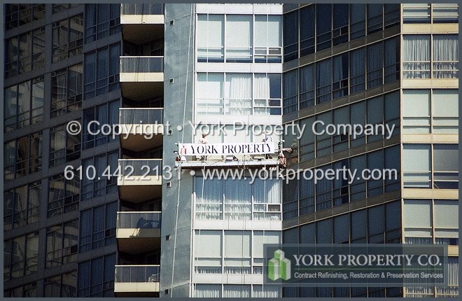 Curtain wall faded paint building restoration.