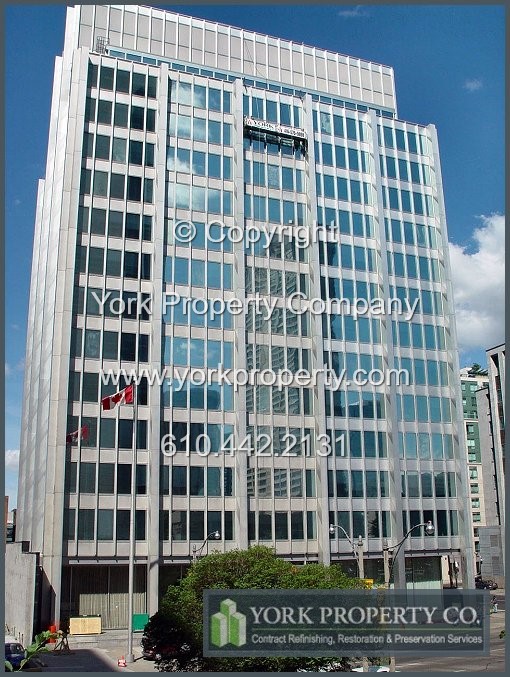 Restoring and refurbishing a sun / UV damaged exterior anodized aluminum curtain wall panel system, anodized aluminum window frame extrusion chemical cleaning, repair and anodized aluminum restoration.