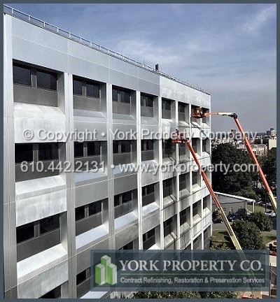 Removing silicone caulking residue and stains from faded, discolored, uneven and oxidized anodized aluminum building facade panels.