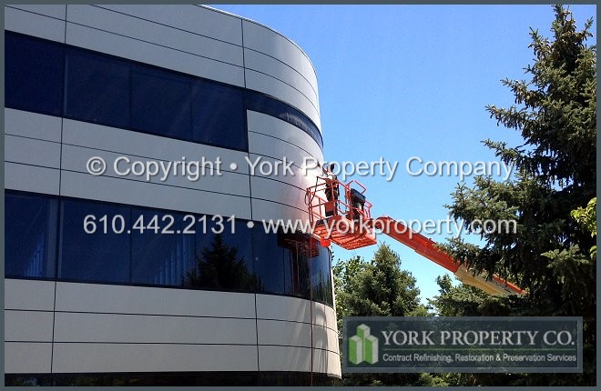 Anodized aluminum building facade cleaning and refinishing.