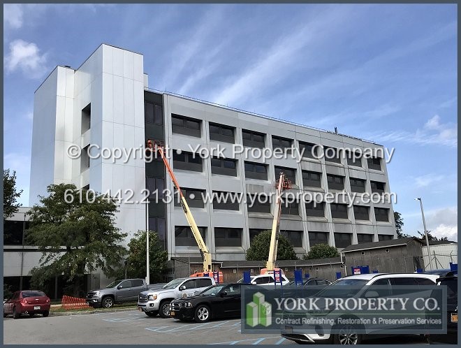 Maintaining weathered anodized aluminum exterior panel system.