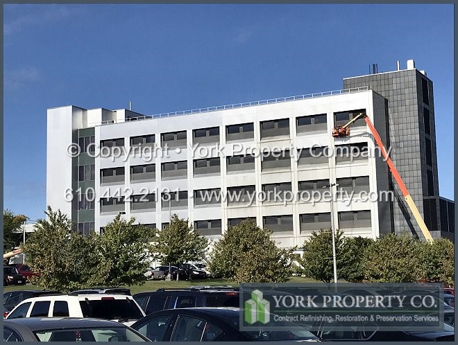 Restoring old anodized aluminum building exterior panels.