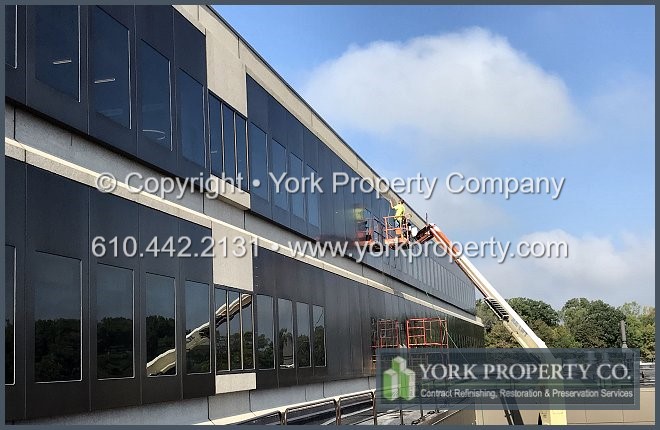 Old bronze anodized aluminum building facade cleaning contractor.